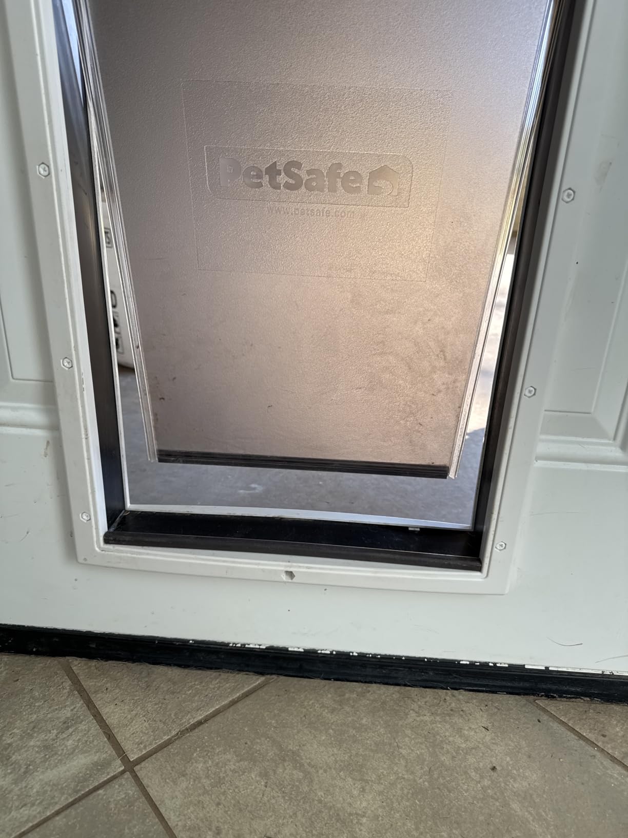 PetSafe Plastic Dog & Cat Door, Pets Up to 220 lb, X-Large | Flap Opening 13 5/8 in W x 23 5/8 in H, Snap-on Closing Panel, Paintable Frame, Easy DIY Install customer photo 1
