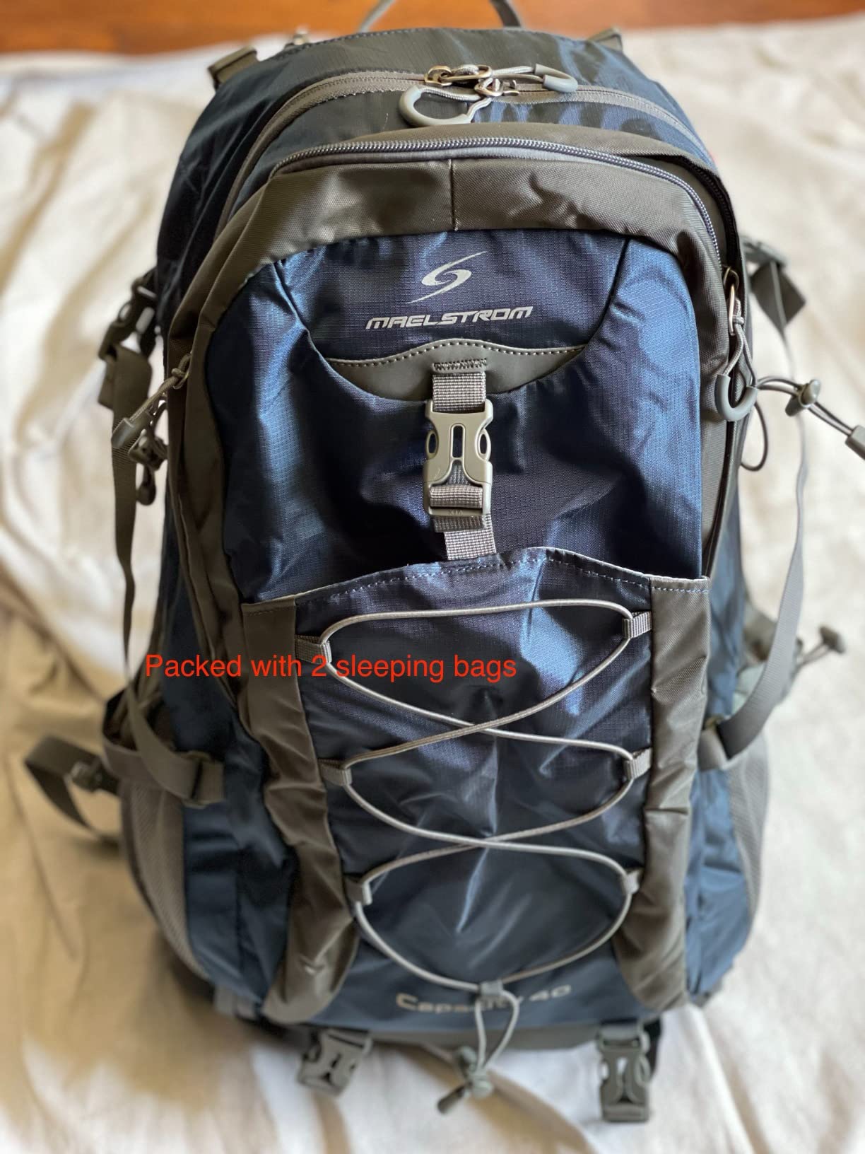 Maelstrom 50L Hiking Backpack, Lightweight Camping Daypack with Rain Cover | Water-Resistant Rip-Stop Nylon, Wet/Dry Separation, Multi-Pockets, Survival Whistle. Ideal For Men, Women, Travel, Trekking customer photo 2