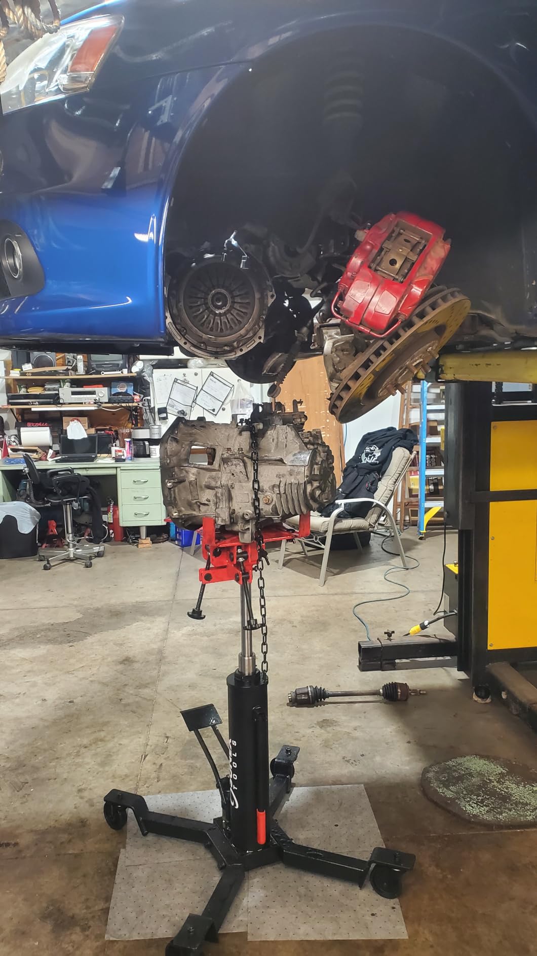 Sunex Tools 7793B 1,000 lb Telescopic Transmission Jack, Hydraulic, Foot Pump Operated, Tilt Saddle with Chain Tie-Down, 74.2 in Max Height customer photo 2
