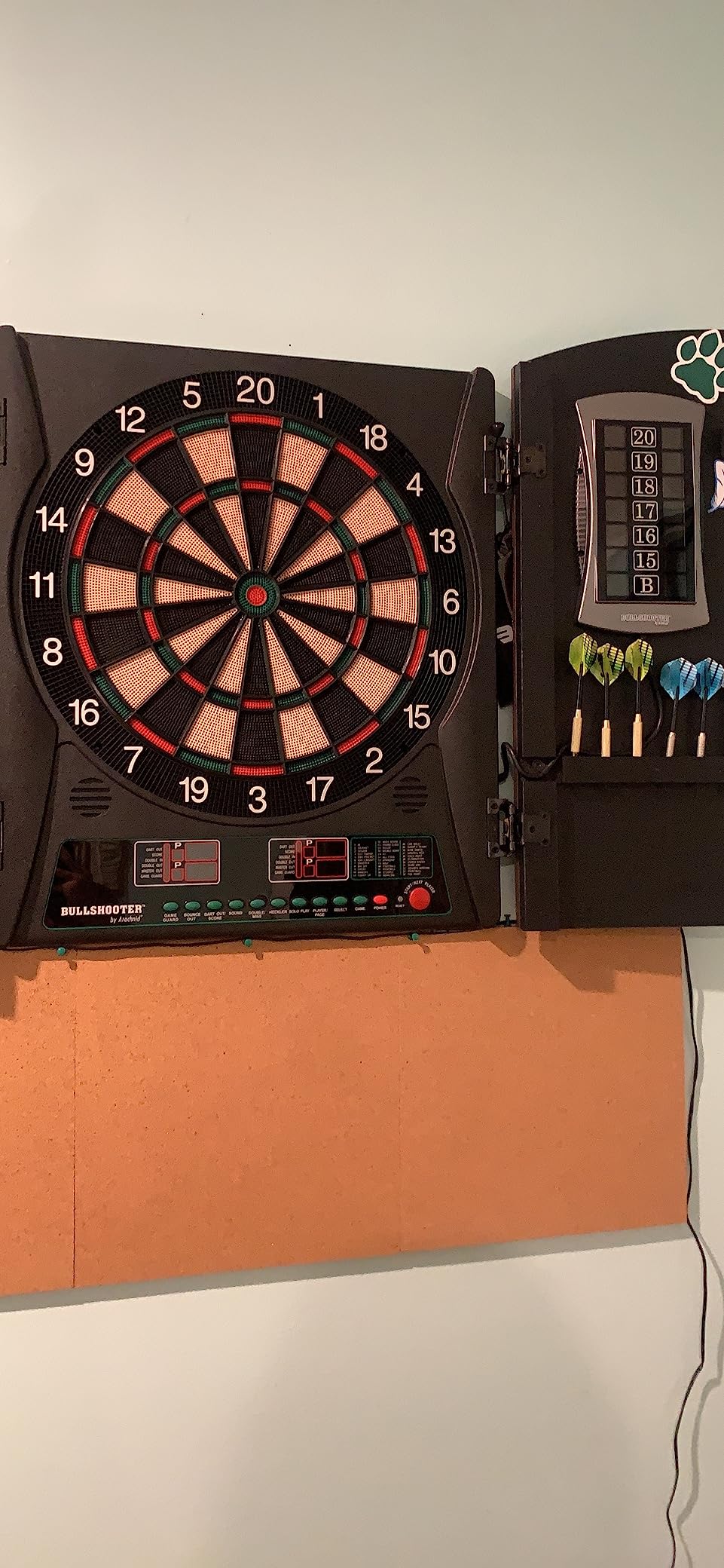 Arachnid CricketMaxx 1.0: 13.5” recreation size with wood cabinet. Features 34 games, 183 variations, 8-player LED X/O scoring, and Heckler mode. Integrated storage for darts and accessories customer photo 1