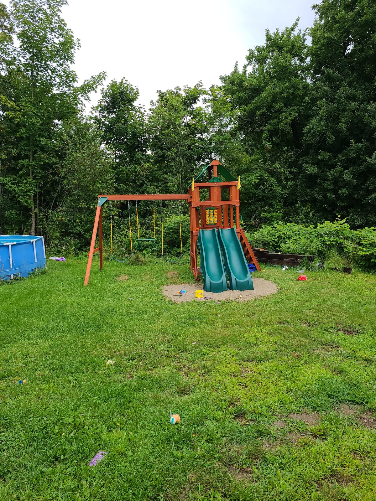 Gorilla Playsets Playmaker Deluxe Wooden Swing Set with Vinyl Canopy Roof, Dual Wave Slides, and Rock Climbing Wall, Redwood Stained Cedar customer photo 1