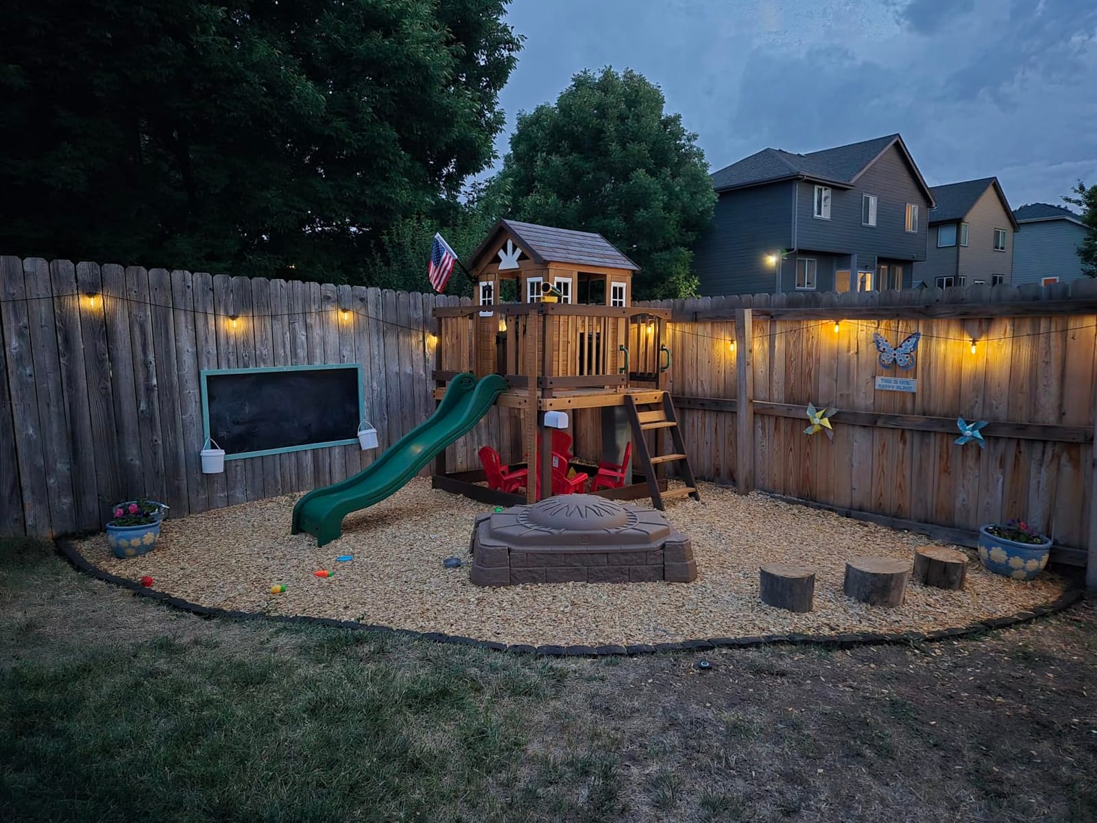 Backyard Discovery Echo Heights Elevated Cedar Wooden Kids Playhouse with Wave Slide, Play Kitchen, Wrap-Around Deck, Flat-Step Ladder, Half Door, Windows, Bell, and Growth Chart for Outdoor Play customer photo 1