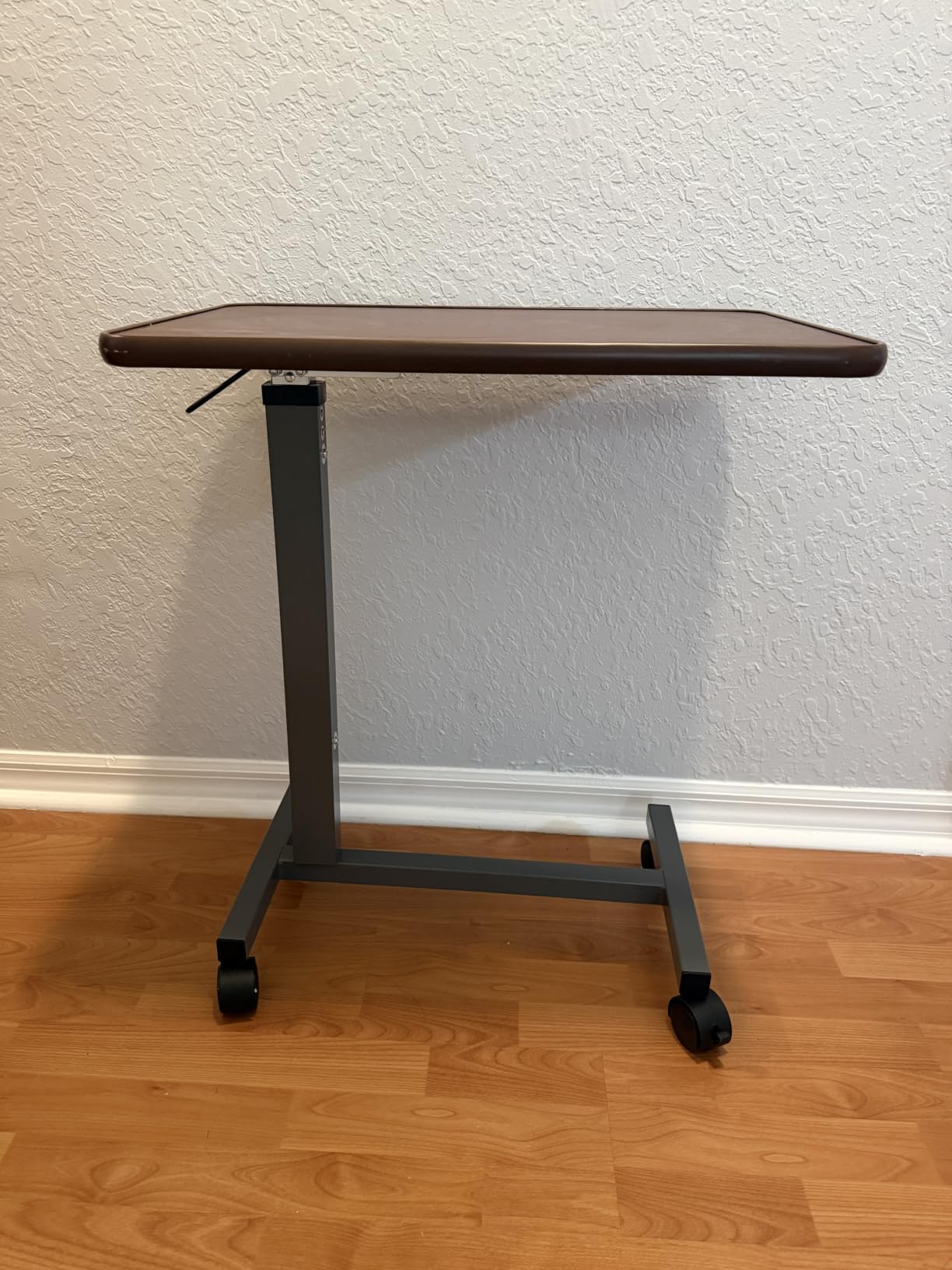 WOTURE Pneumatic Adjustable Overbed Bedside Table with Wheels - Hospital & Home Use, Medical Bed Table, Mobile Standing Desk, Rolling Laptop Cart, Non Tilt Surface(23.6